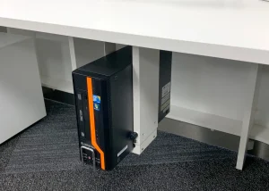 Potenza Building Materials Ltd under-desk CPU holder mounted to improve office space, cable management, and airflow in Essex, Wales, Surrey, Belfast, Scotland, Edinburgh, Wells BA5, North East, North West, South East, Bedfordshire, East Midlands, Hertfordshire, West Midlands, Greater London, Buckinghamshire, Northern Ireland, South West England, Yorkshire and the Humber, and West Raynham, Fakenham NR21, UK.